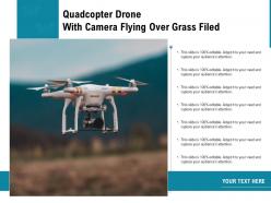 Quadcopter drone with camera flying over grass filed
