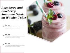 Raspberry and blueberry smoothie drink on wooden table