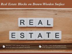 Real estate blocks on brown wooden surface