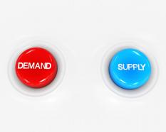 Red and blue buttons for demand and supply stock photo