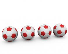 Red and white footballs stock photo