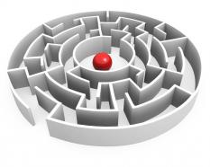 Red ball in maze center showing leadership stock photo