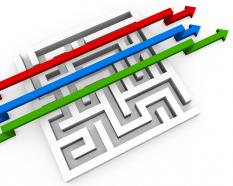 Red blue and green arrows crossing over the maze progress stock photo