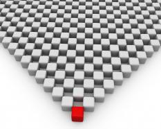 Red cube on triangle of cubes leadership stock photo