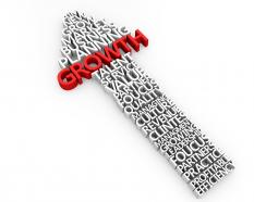 Red growth word on upward arrow showing business growth stock photo