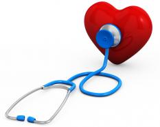 Red heart with blue stethoscope medical check up stock photo