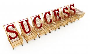 Red letters of success in shopping carts stock photo