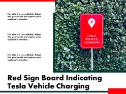 Red sign board indicating tesla vehicle charging