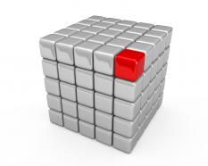 Red single cube on white cube shows leadership concept stock photo
