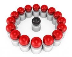 Red spheres in circle with one black sphere as leader stock photo