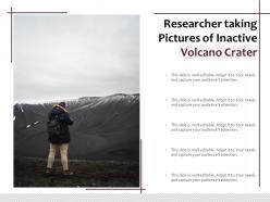 Researcher taking pictures of inactive volcano crater