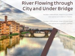 River flowing through city and under bridge