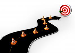 Road with traffic cones reaching on target stock photo