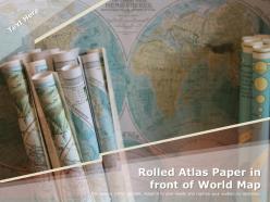Rolled Atlas Paper In Front Of World Map
