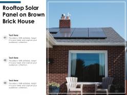 Rooftop solar panel on brown brick house