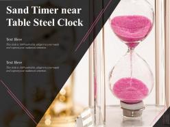 Sand Timer Near Table Steel Clock
