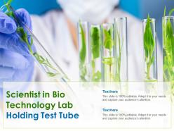Scientist in bio technology lab holding test tube