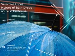 Selective focus picture of rain drops on blue umbrella