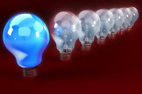 Series of glass bulb with blue bulb as a leader stock photo