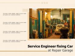 Service engineer fixing car at repair garage