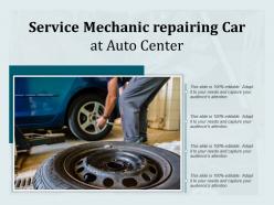 Service mechanic repairing car at auto center