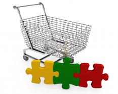 Shopping cart with colored puzzle stock photo