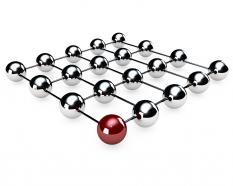 Silver metallic balls with red ball in corner shows leadership stock photo