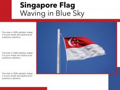 Singapore flag waving in blue sky