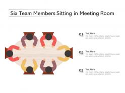 Six team members sitting in meeting room