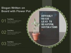 Slogan written on board with flower pot