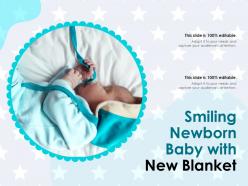 Smiling newborn baby with new blanket