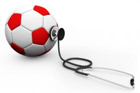 Soccer football with stethoscope isolated on white background stock photo