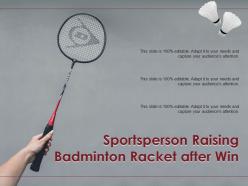 Sportsperson raising badminton racket after win