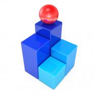 Square blocks with one red ball on top as leader stock photo
