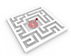 Square maze with target dart in the middle stock photo
