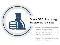 Stack of coins lying beside money bag