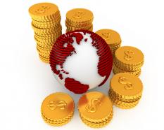 Stack of dollar coins around globe for international market stock photo