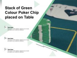 Stack of green colour poker chip placed on table