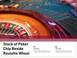 Stack of poker chip beside roulette wheel