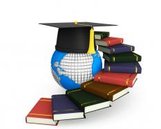 Stairs made of books with globe and graduation cap stock photo