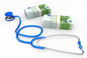 Stethoscope with dollars for finance and health topics stock photo