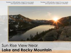Sun rise view near lake and rocky mountain