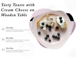 Tasty toasts with cream cheese on wooden table