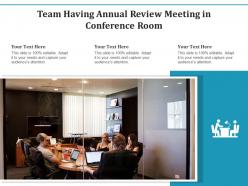 Team having annual review meeting in conference room