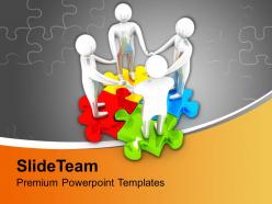 Team joining hands on colorful puzzle powerpoint templates ppt themes and graphics 0213
