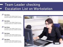 Team leader checking escalation list on workstation