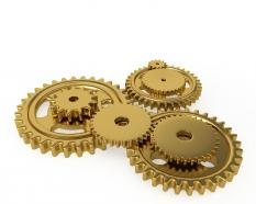 Team Of Golden Gears Working Together Stock Photo