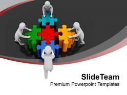 Team pushing colorful puzzles teamwork powerpoint templates ppt themes and graphics 0213