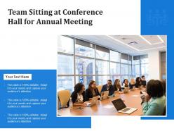 Team sitting at conference hall for annual meeting