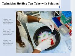 Technician holding test tube with solution